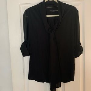 Black blouse with neck tie and see through arms.
